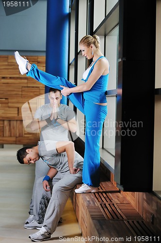 Image of young adults group in fitness club