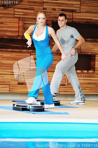 Image of young adults group in fitness club