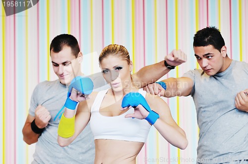 Image of young adults group in fitness club