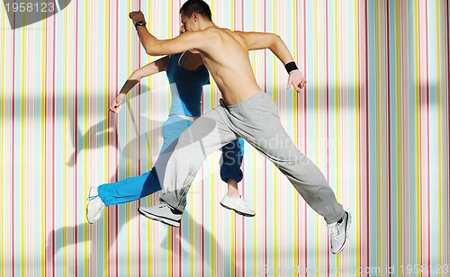 Image of young adults group in fitness club