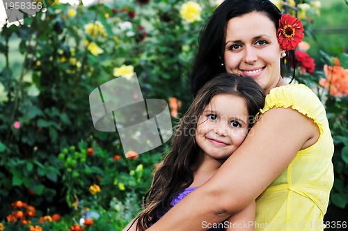 Image of happy mom and daughter outdoor