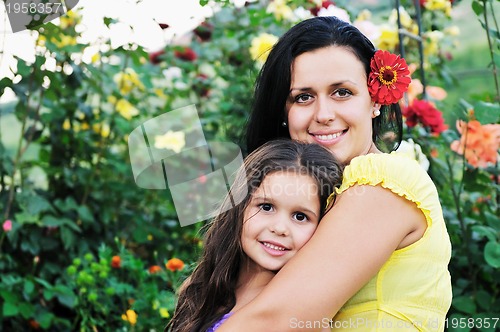 Image of happy mom and daughter outdoor