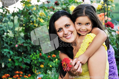 Image of happy mom and daughter outdoor
