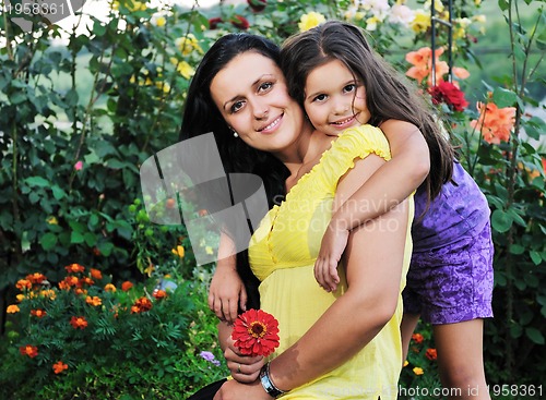 Image of happy mom and daughter outdoor