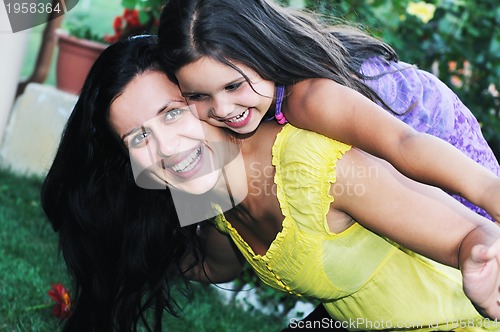 Image of happy mom and daughter outdoor