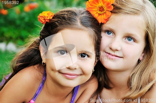 Image of two happy girls have fun outdoor 