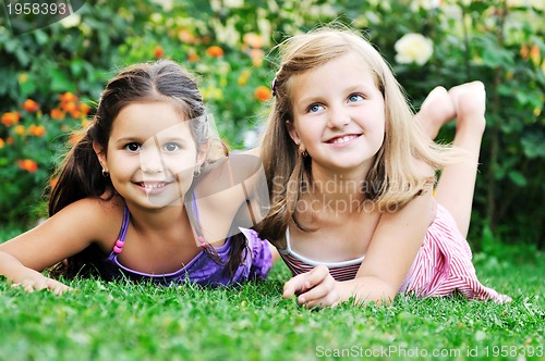 Image of two happy girls have fun outdoor 