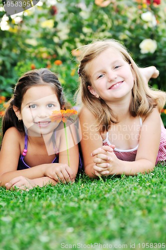 Image of two happy girls have fun outdoor 