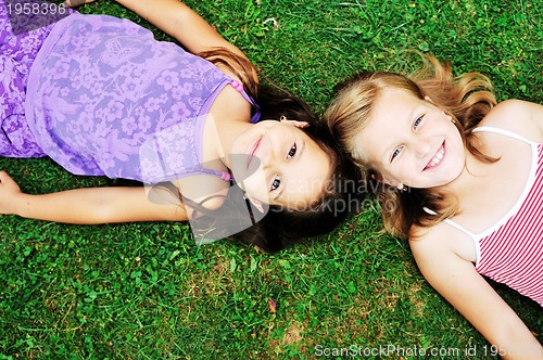 Image of two happy girls have fun outdoor 