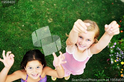 Image of two happy girls have fun outdoor 