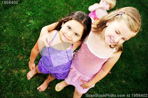 Image of two happy girls have fun outdoor 