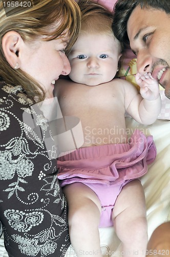 Image of portrait of young family with  cute little babby
