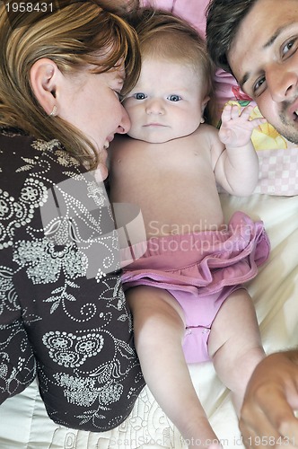 Image of portrait of young family with  cute little babby