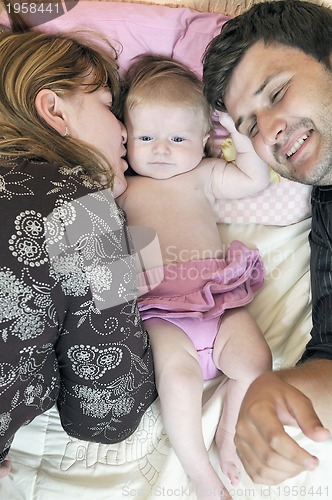 Image of portrait of young family with  cute little babby