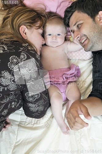 Image of portrait of young family with  cute little babby