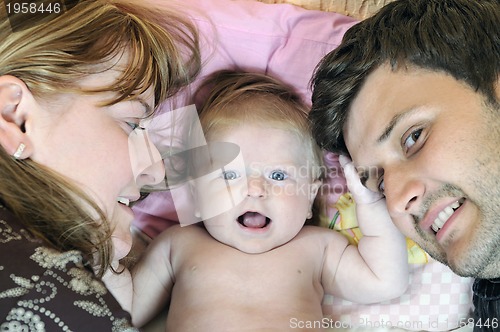 Image of portrait of young family with  cute little babby