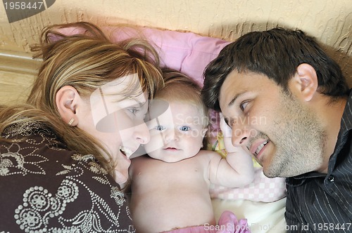 Image of portrait of young family with  cute little babby