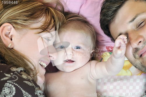 Image of portrait of young family with  cute little babby