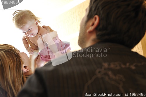 Image of portrait of young family with  cute little babby