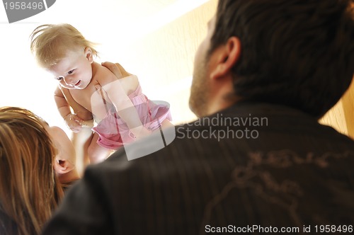 Image of portrait of young family with  cute little babby