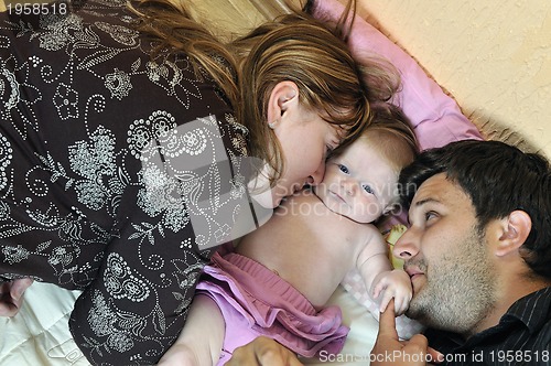 Image of portrait of young family with  cute little babby