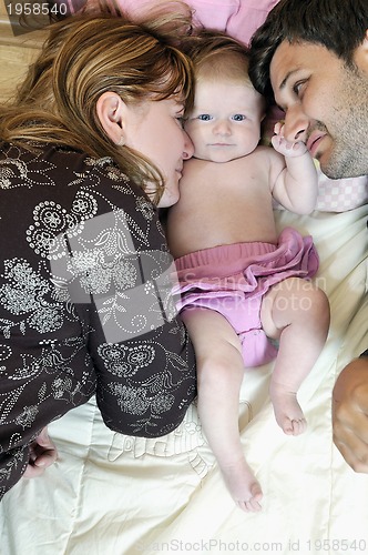 Image of portrait of young family with  cute little babby