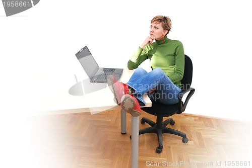 Image of casual girl relaxing at the office