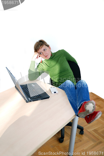 Image of casual girl relaxing at the office