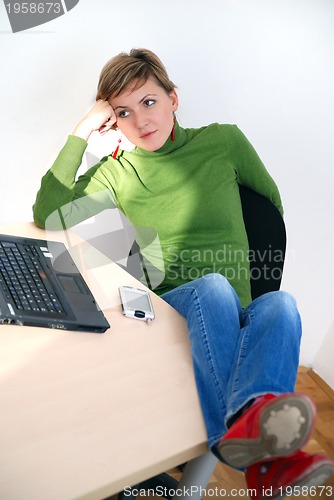 Image of casual girl relaxing at the office