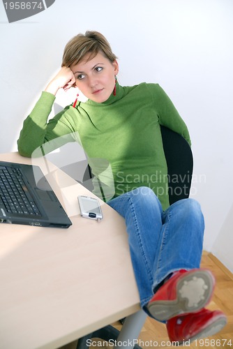 Image of casual girl relaxing at the office