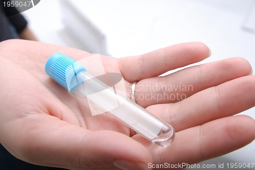 Image of test-tube in woman hand