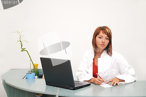 Image of Smilling nurse with laptop