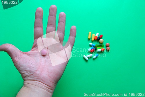 Image of pills in hand