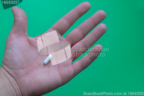 Image of pills in hand