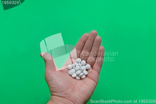 Image of pills in hand