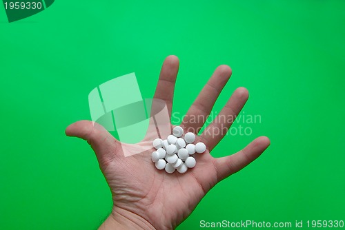 Image of pills in hand