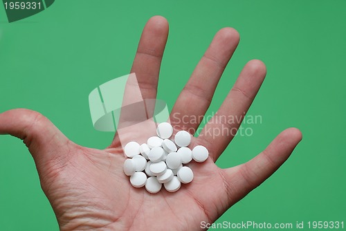 Image of pills in hand