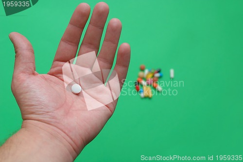 Image of pills in hand