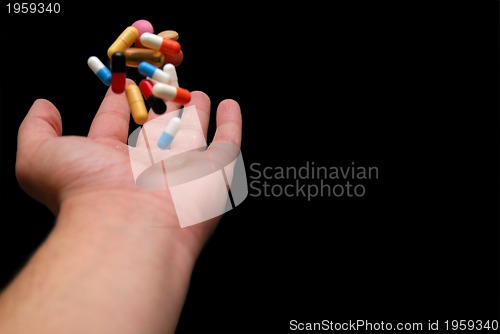 Image of pills in hand