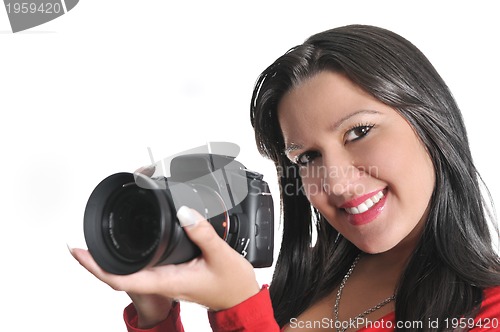 Image of Young woman holding camera in hand taking picture isolated