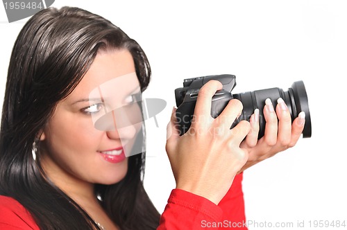 Image of Young woman holding camera in hand taking picture isolated