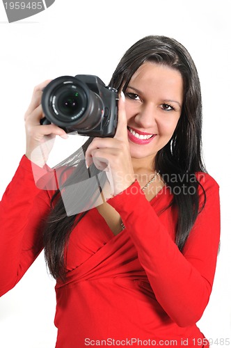 Image of Young woman holding camera in hand taking picture isolated