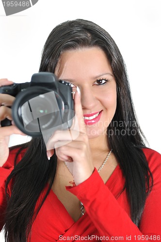 Image of Young woman holding camera in hand taking picture isolated