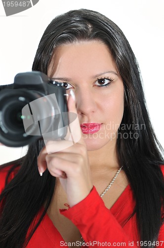 Image of Young woman holding camera in hand taking picture isolated