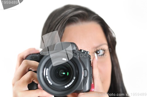 Image of Young woman holding camera in hand taking picture isolated