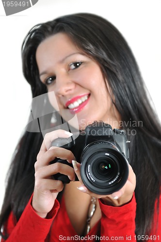 Image of Young woman holding camera in hand taking picture isolated