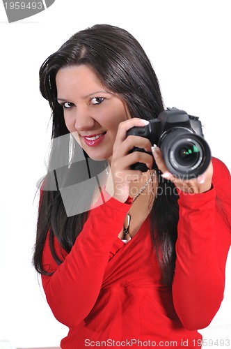 Image of Young woman holding camera in hand taking picture isolated