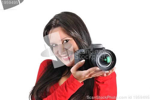 Image of Young woman holding camera in hand taking picture isolated