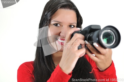 Image of Young woman holding camera in hand taking picture isolated