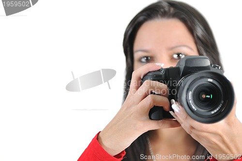 Image of Young woman holding camera in hand taking picture isolated